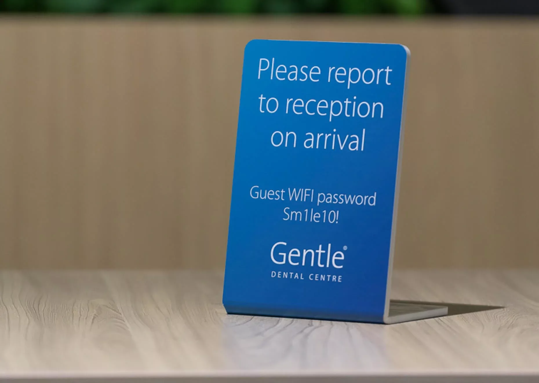 Gentle Dental sign that reads "please report to reception on arrival"