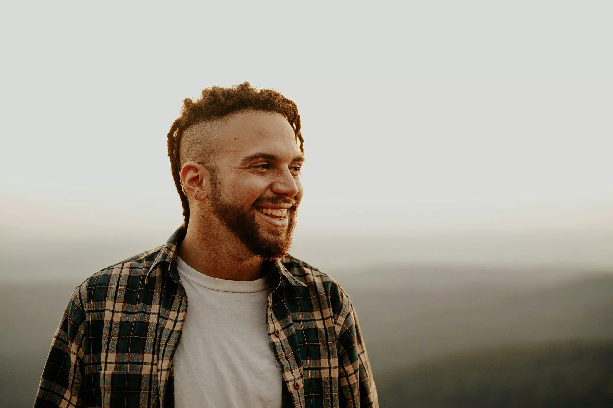 Man smiling and thinking about his dental health